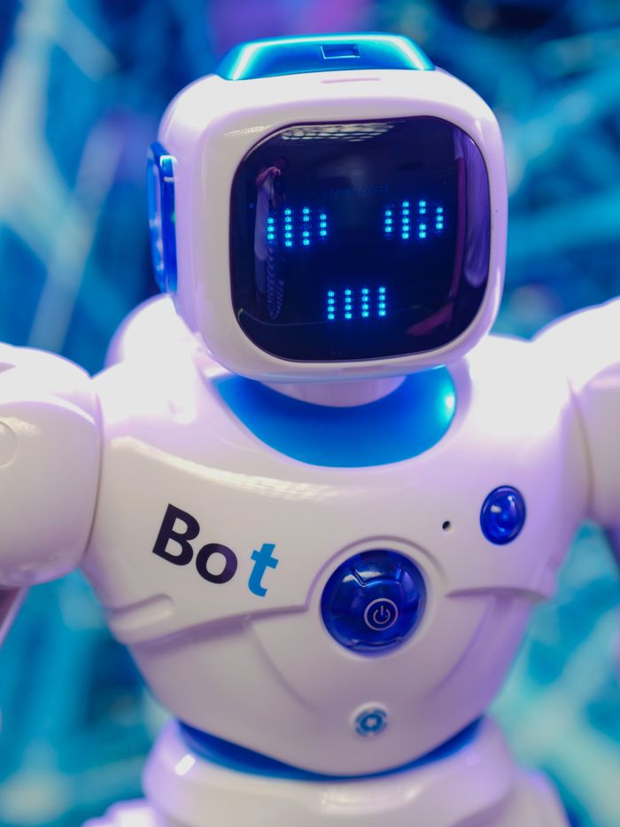 Mastering the First Impression: Your intriguing post title goes here White humanoid robot toy with illuminated face display representing modern technology.