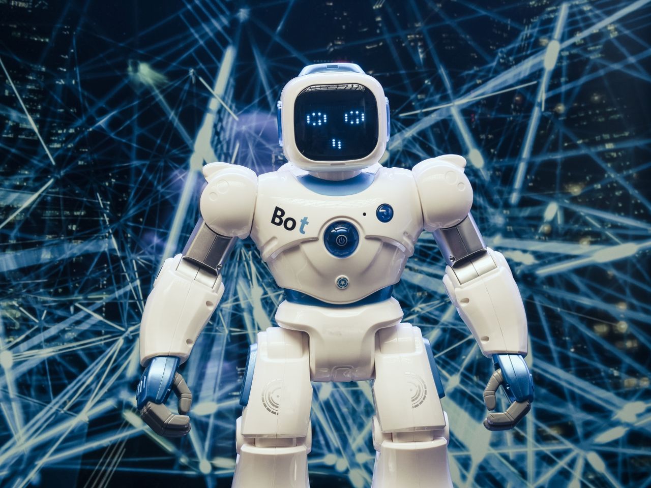 Crafting Captivating Headlines: Your awesome post title goes here A modern humanoid robot with luminous features set against a digital network backdrop.