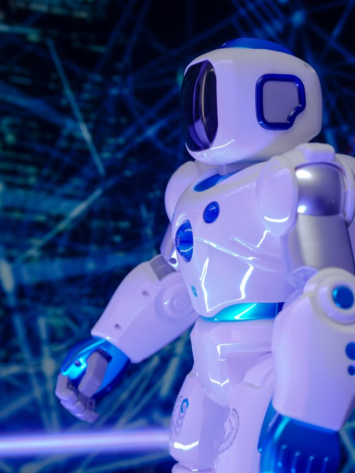 The Art of Drawing Readers In: Your attractive post title goes here Close-up of a modern humanoid robot with glowing blue lights and futuristic design.